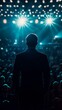 © Denys - Businessman standing on stage addressing audience at night event