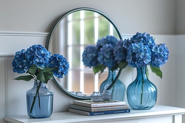 Wall Mural - A blue vase with flowers sits on a white shelf next to a mirror