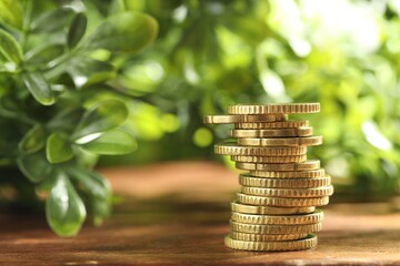 Wall Mural - Stack of euro coins on wooden table