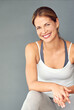 © peopleimages.com - Fitness, portrait or woman in studio with smile, confidence or positive attitude. Face, female person or wellness on wall background with growth, pride or ready for exercise or happiness for progress