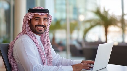 Wall Mural - Arab businessman using a laptop