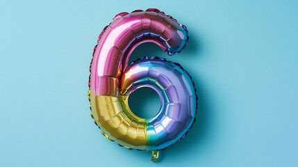 Rainbow foil balloon number six. Top view. Colored number on blue background.