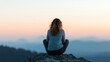 ©  lukaPixMedia - A woman sits on a rock, watching a serene sunset over mountains, capturing a moment of tranquility and introspection in the great outdoors.