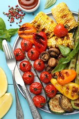 Poster - Delicious grilled vegetables served on light blue wooden table, flat lay