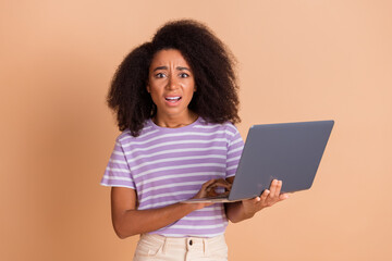 Sticker - Portrait of pretty young woman hold laptop stare wear striped t-shirt isolated on beige color background