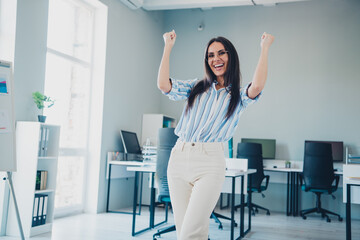 Canvas Print - Photo of nice woman winning celebrate dressed striped formalwear comfortable light startup office room interior