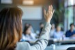 © alisaaa - Close up of businesswoman raising her hand on a seminar in board room. Close up of unrecognizable businesswoman raising her hand to ask the question on a seminar in board room.