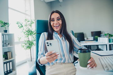 Sticker - Photo of smart chief female hold device drink coffee excited wear striped formalwear comfortable modern office interior indoors workspace