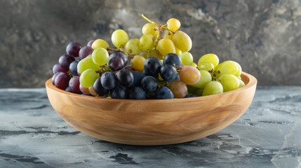 Wall Mural - Mixed grapes in a wooden bowl, emphasizing the diversity of shapes and hues