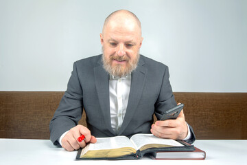 happy bearded man studies the Bible. religion and Christianity.