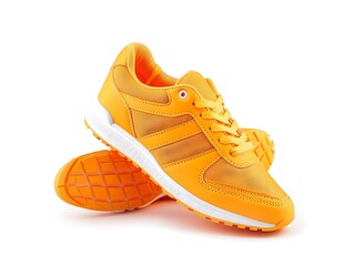 Wall Mural - pair of orange sneakers isolated on white background