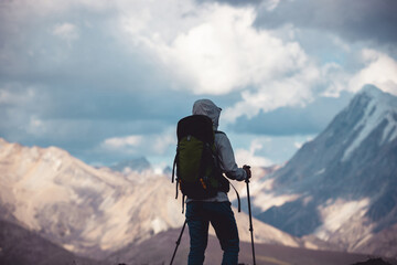 Wall Mural - Woman hiking on high altitude mountain top