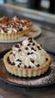 © Zivorad - A delicious tart is topped with a generous swirl of whipped cream, sprinkled with chocolate chips, and dusted with powdered sugar, creating an enticing dessert display.