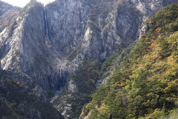 Wall Mural - Autumnal view and high angle of Towangseong Waterfall at Seoraksan Mountain near Sokcho-si, South Korea