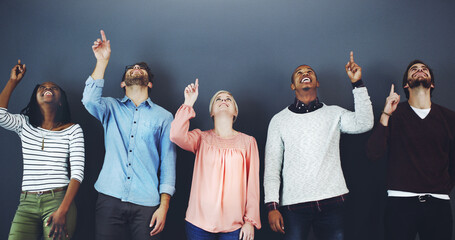 Poster - Pointing, mockup space and team of business people in studio wait for corporate interview. Direction, happy and group of financial advisors by gray background for finance recruitment or vacancy.