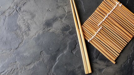 Zen Sushi Dining Setting - Two Chopsticks on Bamboo Mat with Copy Space on Wooden Background, Top View