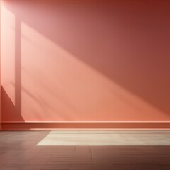 Gallery space with blank pastel pink coral wall illuminated by spotlight, casting dramatic shadows.