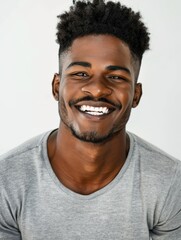 Wall Mural - Authentic Portrait: Smiling Young African American Man in Grey T-shirt, Studio Photoshoot