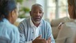 © Anna - Middle-aged man with gray hair and beard, engaged in a thoughtful conversation with two people.