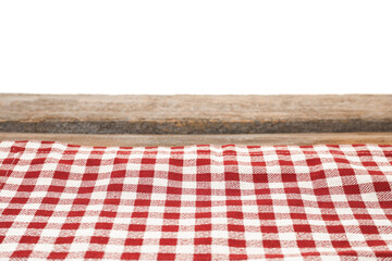 Wall Mural - Tablecloth with checkered pattern on wooden table against white background