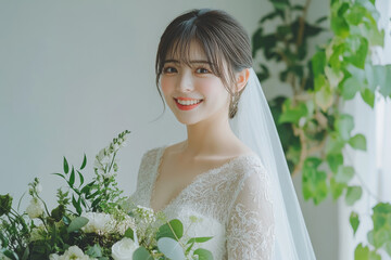 Wall Mural - a Japanese woman in a white wedding dress, with short hair, smiling and holding flowers