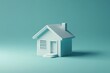 © Keattipoom - Modern 3D Render of House Icon on Pale Teal Background with Soft Porcelain Texture in Seafoam and Silver Palette