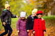 © oksix - Group of friends play in autumn park
