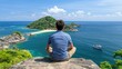 © pvl0707 - A man enjoys the breathtaking view of Nusantara L Nordini's turquoise sea and islands in the enchanting late afternoon light