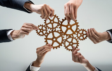 Business team joining cogwheel in circular together symbolize successful group of business partnership and strong collective teamwork unity in workplace community with productive efficiency. Shrewd