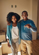 © StarDweller/peopleimages.com - Hug, keys and portrait of black couple in new home with box goods in living room for real estate investment. Love, property or smile with happy man and woman in apartment for growth or mortgage