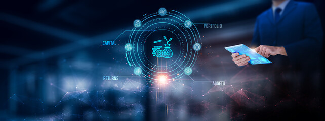 Investment: Businessman using tablet analyzing investment record on tablet. Digital data and network connection on modern virtual screen interface, analytics, technology, and network.