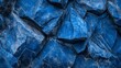 © Vagner Castro - An abstract background featuring blue rocks with varying textures and shades. The organic shapes and cool tones create a visually intriguing, serene, and artistic composition.