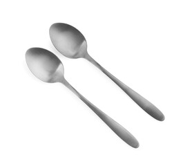 Wall Mural - Stainless steel spoons on white background