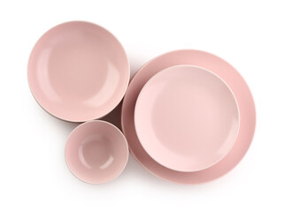 Wall Mural - Set of different pink plates on white background