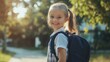 © Elkhan Babayev - Spirited young schoolgirl in uniform proudly carries her backpack, exuding school style