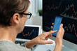 © Summit Art Creations - Smart stock investors pointing on screen with smartphone for market stock exchange along with laptop screen in highest dynamic investment rate, focusing data planning at modern workplace. Pecuniary.