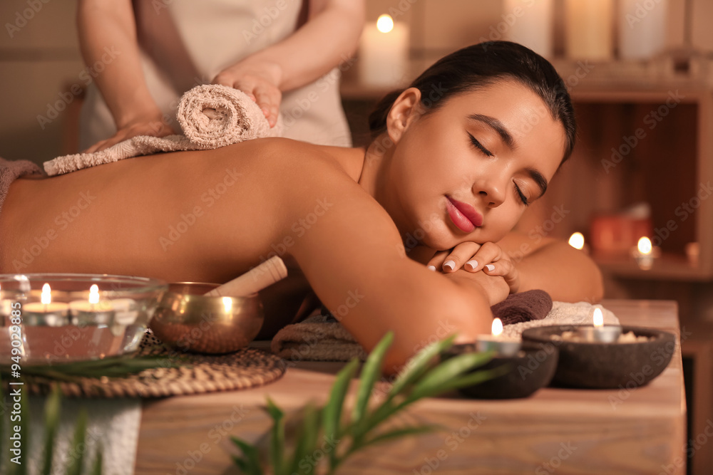 Beautiful woman receiving spa massage in salon