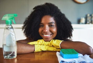 Wall Mural - Black woman, clothes and portrait by cleaning counter with spray, shine or gloves for bacteria in home. Person, happy and chemical for wood table, sponge or disinfection for hygiene at house in Kenya