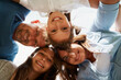 © StarDweller/peopleimages.com - Huddle, family and smile in embrace, portrait and low angle of group, outdoor and bonding in outing. Happy, people and parents with love for children, woman and man with girls, daughter and together