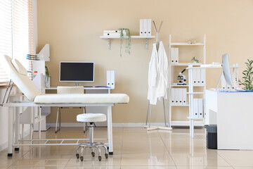 Canvas Print - Light interior of doctor's office with modern workplace and couch