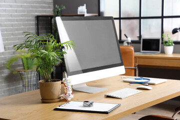 Wall Mural - Modern workplace of doctor with computer in clinic