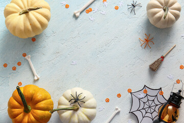 Wall Mural - Frame made of pumpkins and decorations for Halloween on light background