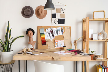 Poster - Fashion designer's workplace with pin board and mannequin head in studio