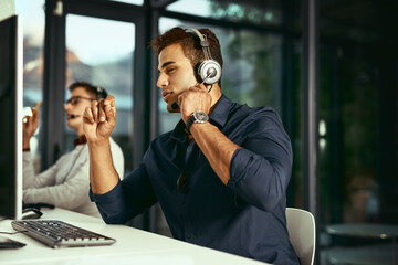 Poster - Man, talking and tech in call center for advice, telemarketing and customer service. Agent, headset and contact in office for IT support, lead generation and digital sales at help desk or company FAQ