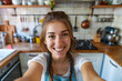 © Erick - Smiling homeowner taking a selfie with her newly renovated kitchen in the background, celebrating the success of her DIY project.