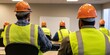 © Thanthara - Construction workers in safety gear attending a training session in a classroom setting, focusing on safety protocols and job skills