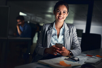 Poster - Happy business woman, portrait and night with phone for online service, advice or project deadline at office. Young, female person or financial advisor working late with smile or mobile smartphone