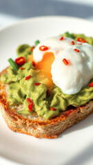 Wall Mural - Avocado Toast with Poached Eggs and Chili Flakes