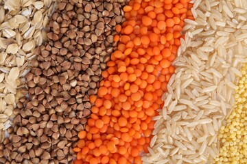 Different grains and cereals as background, top view