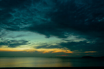 Sea view, bright blue morning sky with dark black and white clouds and deep blue ocean on a day, feel calm, cool, relax, idea for use as a modern